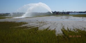 Applying dredge sediment to a New Jersey salt marsh. TNC