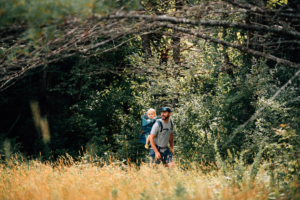 Family hiking on lands that connect to the Mill Hill Forest tract. Photo by Cait Bourgault